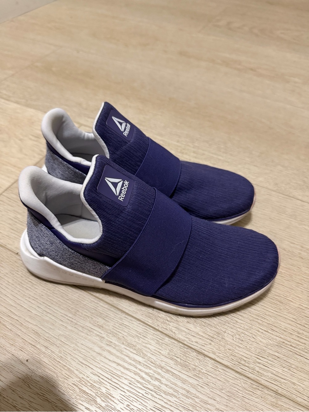 Reebok women’s Slip-On Athletic Shoes in purple